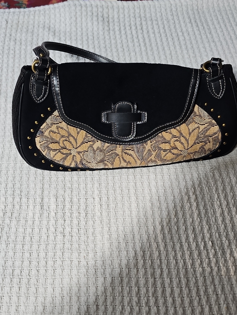 The Sak Black Shoulder Bag with Gold Floral Panels